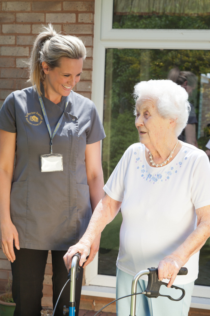 Carer with client and walking frame